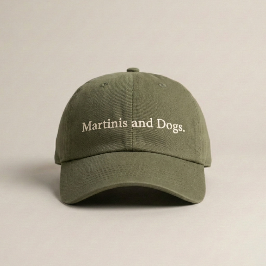 Snarky Barks 'Martinis and Dogs.' olive green embroidered dad hat, front view