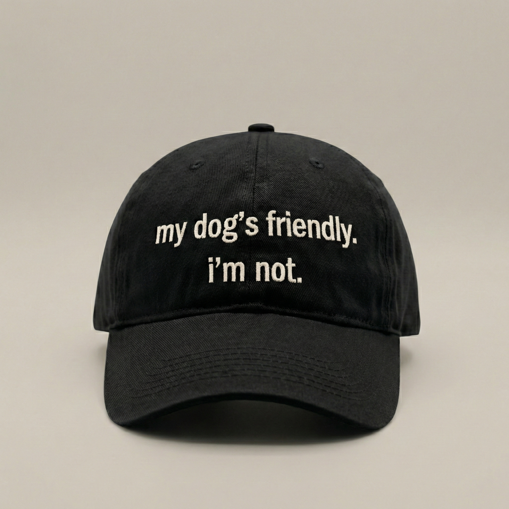 Snarky Barks 'my dog's friendly. i'm not.' black embroidered dad hat, front view
