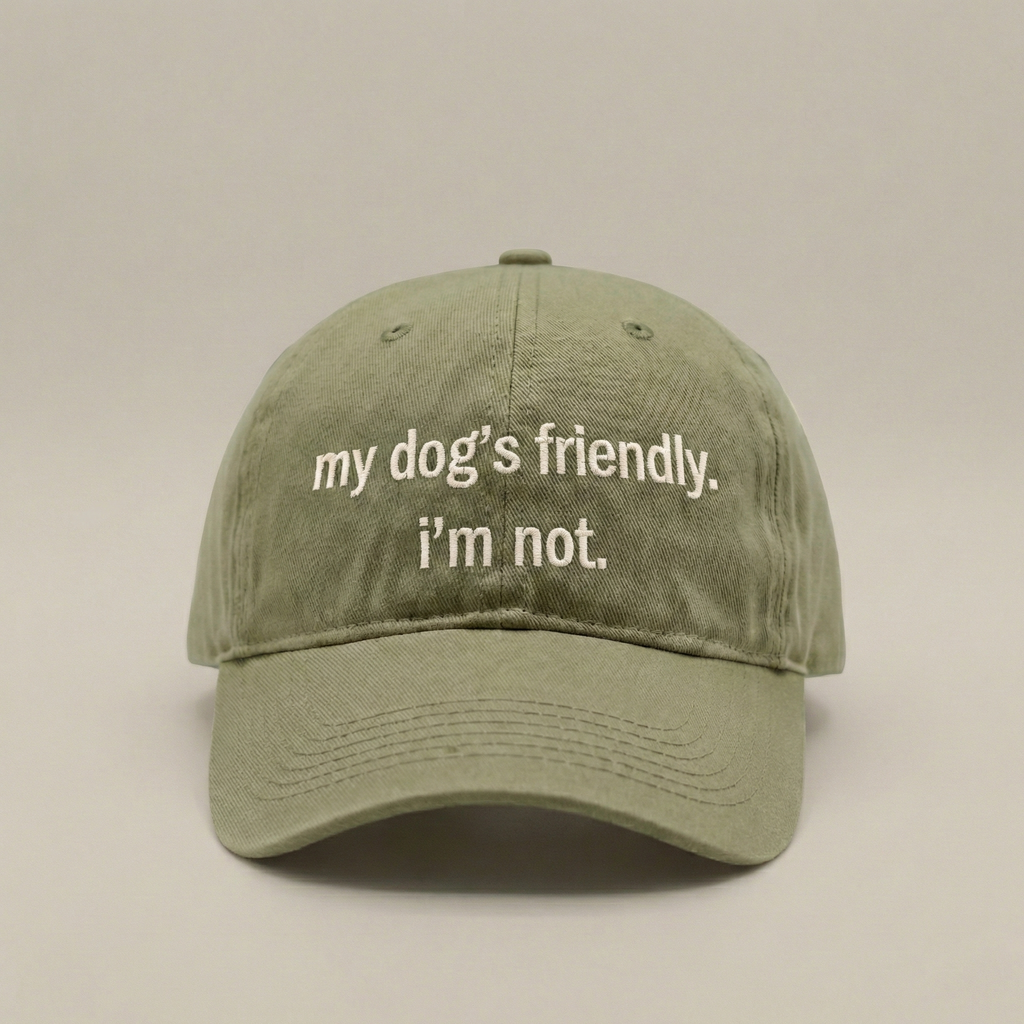 Snarky Barks 'my dog's friendly. i'm not.' olive green embroidered dad hat, front view