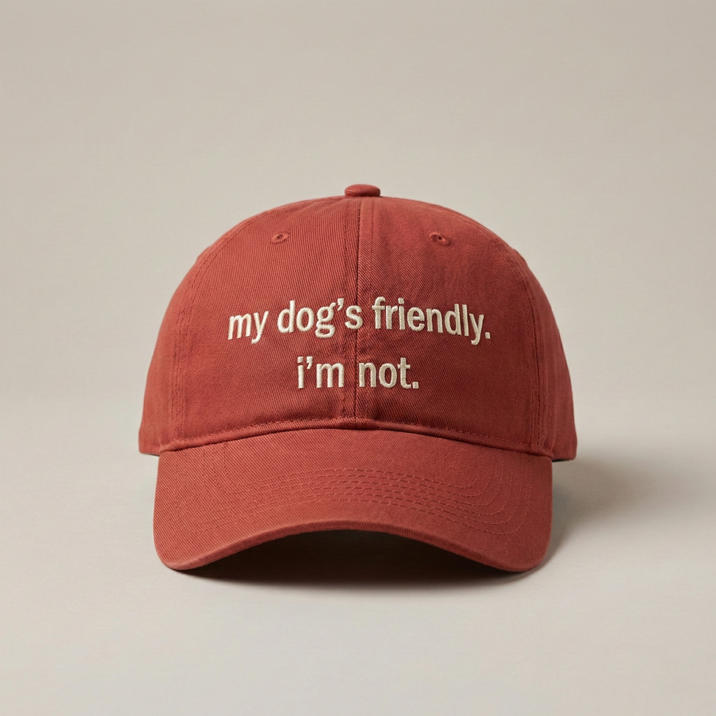 Snarky Barks 'my dog's friendly. i'm not.' burnt red embroidered dad hat, front view
