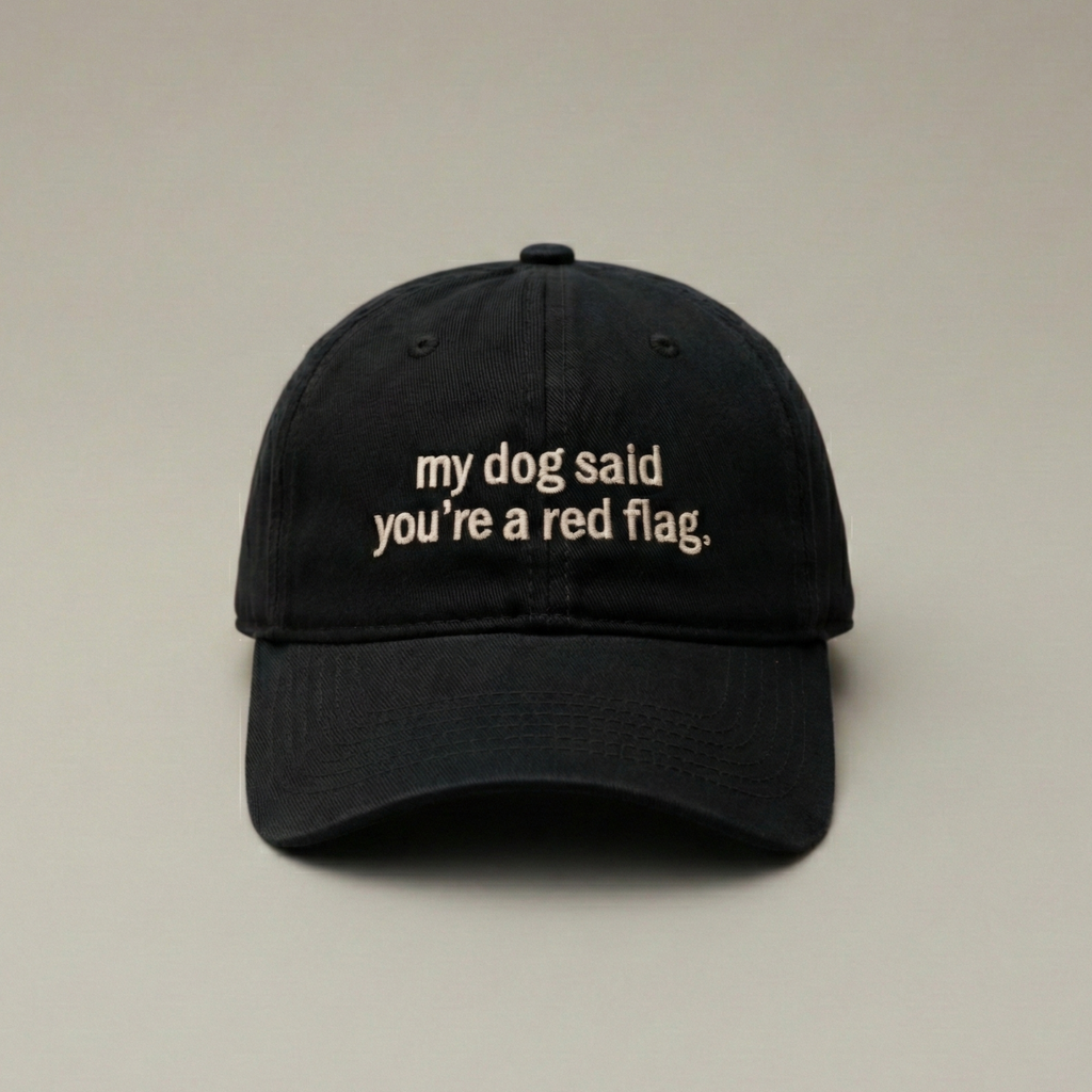 Snarky Barks 'my dog said you're a red flag.' black embroidered dad hat, front view