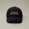 Snarky Barks 'my dog said you're a red flag.' black embroidered dad hat, front view