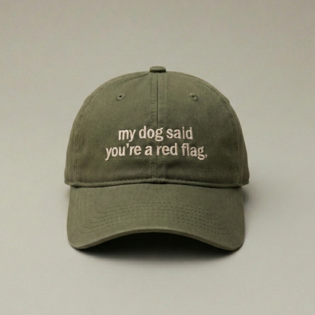 Snarky Barks 'my dog said you're a red flag.' olive green embroidered dad hat, front view